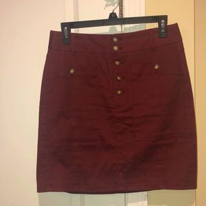 Maroon jean skirt with tortoise buttons